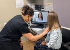  Example of a teleconsult appointment with a nurse and patient in clinic, and a provider on-screen via secure video.

