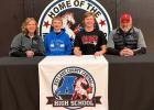 Oliver Melin signed to play football with Valley City State University. He is shown with his parents.