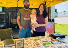 Bagley Farmers Market Manager Annie Braught, husband Nathan and their now one year-old Sophia